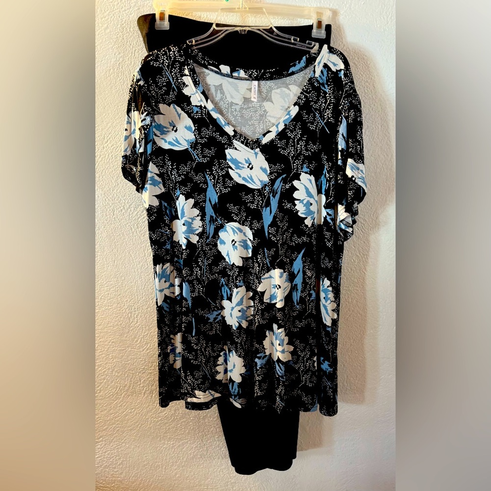 This is a Beautiful White/Black Top that comes with a Black Slack.